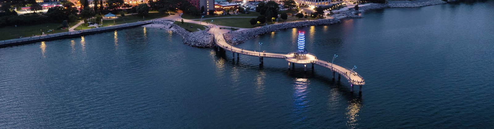 The Brant Street Pier lit up at dusk on the Burlington waterfront